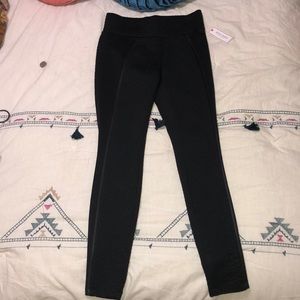 Black leggings with black snakeskin-like print